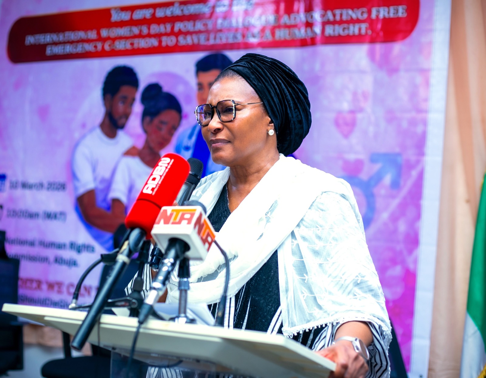 A leader addressing press at the International Women's Day Policy Dialogue